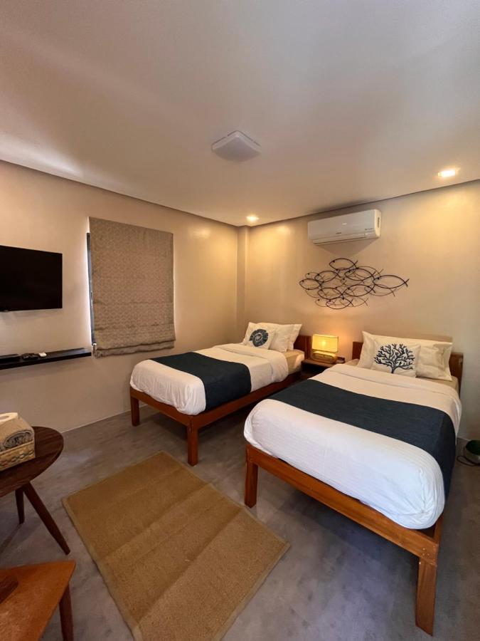 Southseas Beach Resort And Dive Center Сантандер Екстериор снимка