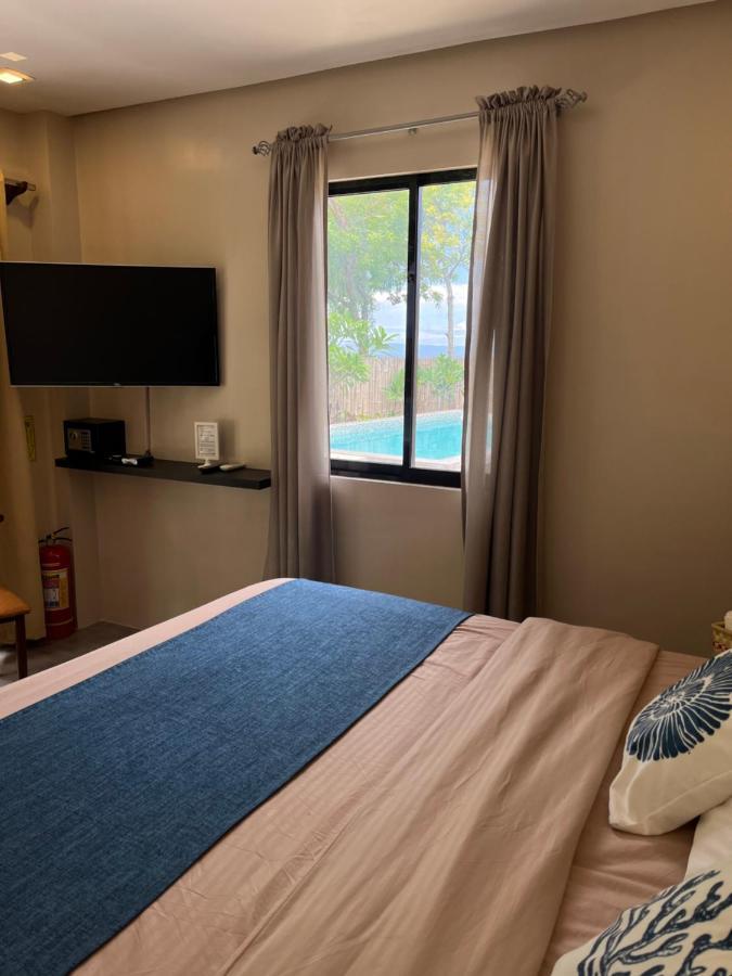 Southseas Beach Resort And Dive Center Сантандер Екстериор снимка