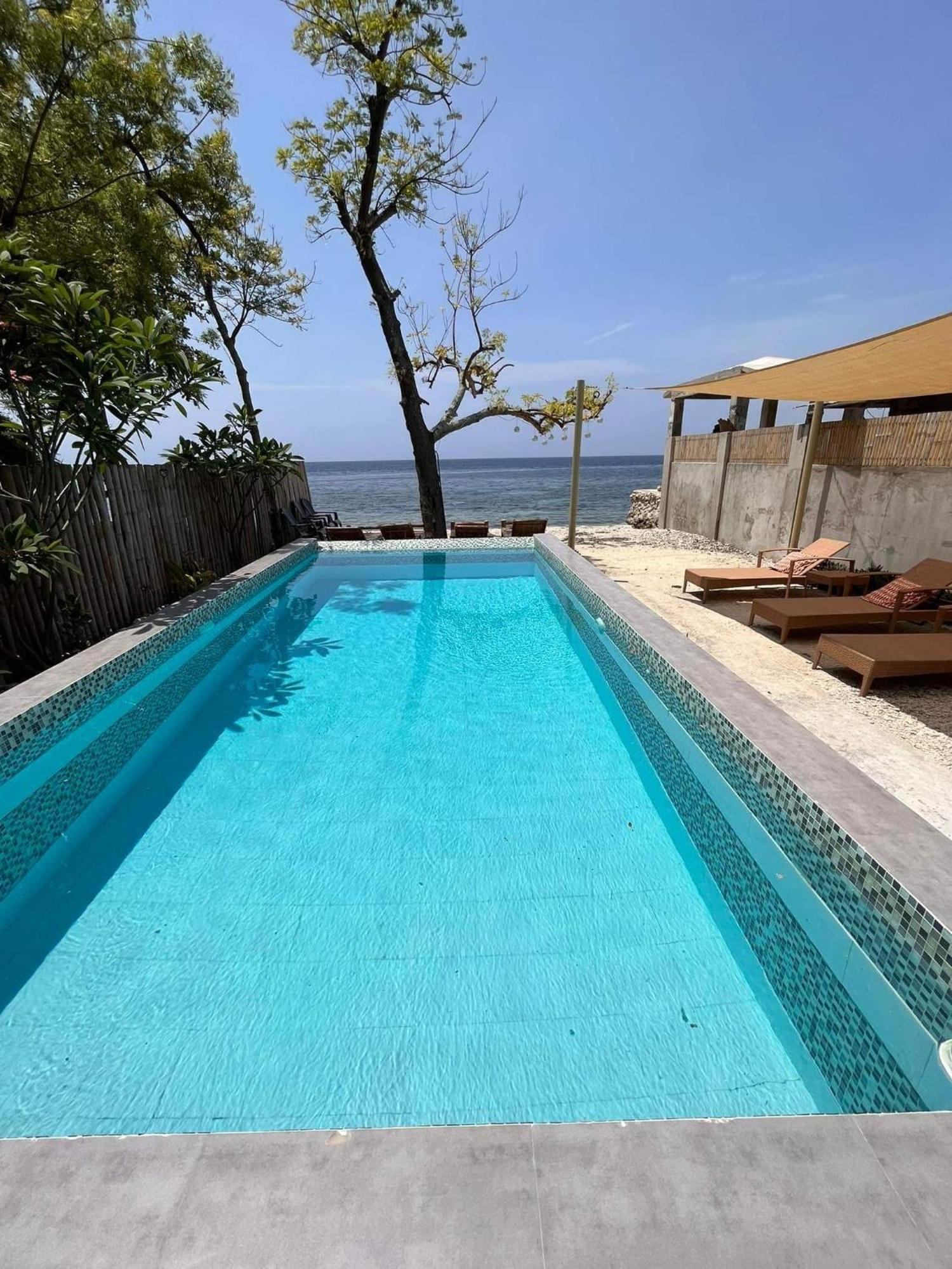 Southseas Beach Resort And Dive Center Сантандер Екстериор снимка